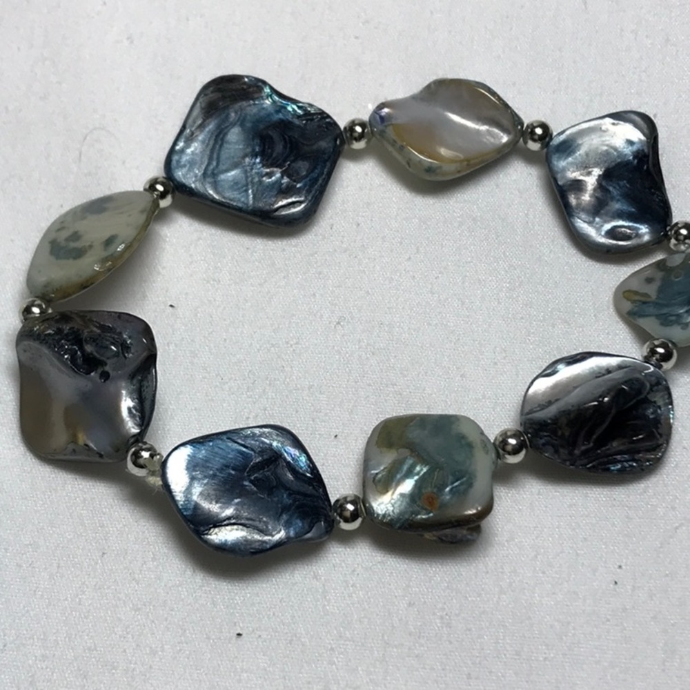 Natural shell bracelet, stretch with silver tone beads, fits 8 in wrist
